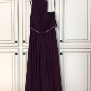Never worn, strapless, floor length gown.